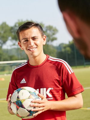 Employee Murat Kocapinar at football training