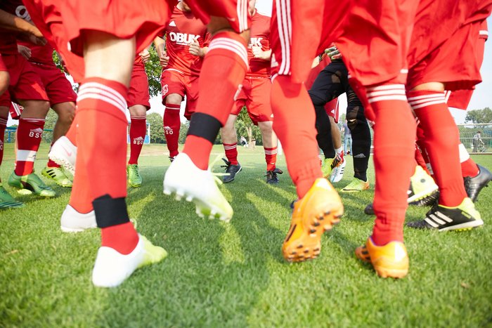 Close-up of players' legs during football training