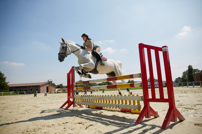 Employee Aline Pätzke during riding training