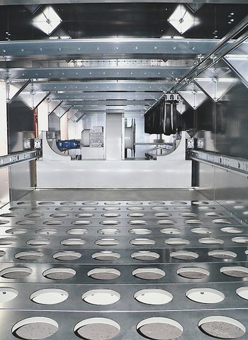 Filtered air space for a reverse air filter with a cleaning unit