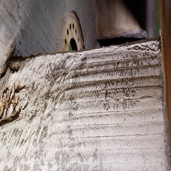  Fan impeller, showing baked-on deposits and severe wear 